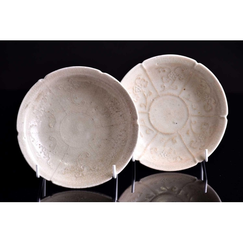 285 - A pair of Chinese mallow flower shaped dishes, Yuan dynasty, each celadon glazed with six sectioned ... 