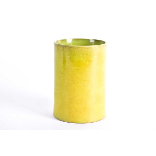 297 - A Chinese monochrome bitong, Qing, the cylindrical body with a mustard yellow glaze throughout, 14cm... 