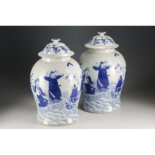 301 - A pair of Chinese blue and white vases and covers, Qing, late 19th century, painted with the eight T... 