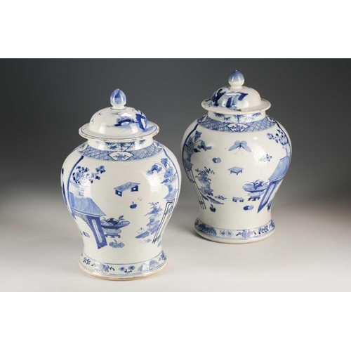 306 - A pair of Chinese blue and white vases and covers, Qing, late 19th century, the covers painted with ... 