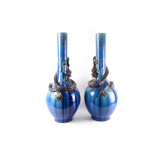 307 - A pair of large Japanese pottery dragon vases, Meiji/Taisho period, the onion shaped bodies with a d... 