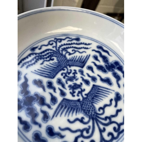 309 - A Chinese blue & white double phoenix dish, six character mark of Guangxu, painted with two phoenix ... 