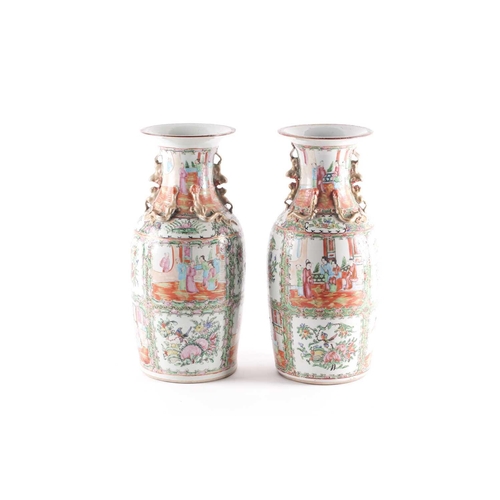 311 - A pair of Canton enamel vases, Qing, 19th century, the flared rim above gilt shi-shi handles and chi... 