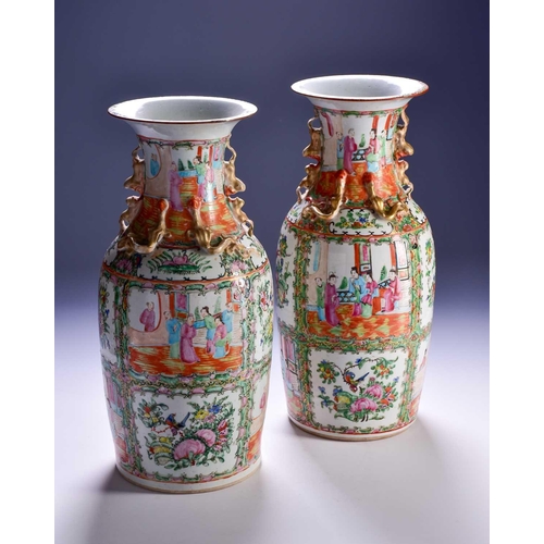 311 - A pair of Canton enamel vases, Qing, 19th century, the flared rim above gilt shi-shi handles and chi... 