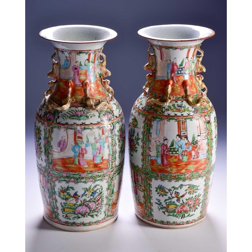 311 - A pair of Canton enamel vases, Qing, 19th century, the flared rim above gilt shi-shi handles and chi... 