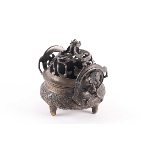 321 - A Chinese bronze censer, late Qing, the openwork cover with a long eared chilong amongst meandering ... 