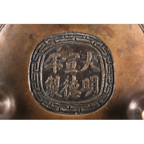 321 - A Chinese bronze censer, late Qing, the openwork cover with a long eared chilong amongst meandering ... 