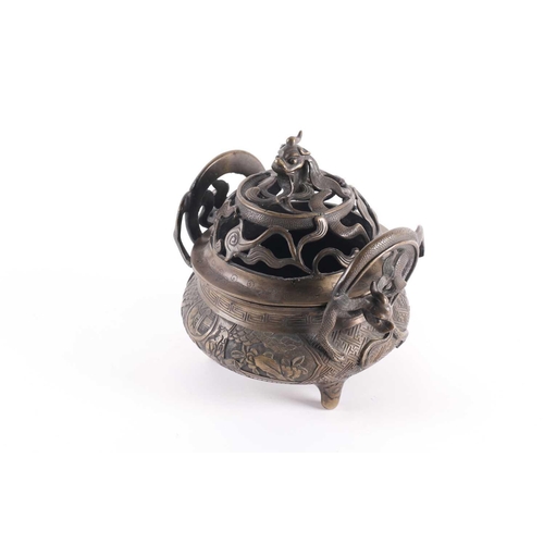 321 - A Chinese bronze censer, late Qing, the openwork cover with a long eared chilong amongst meandering ... 