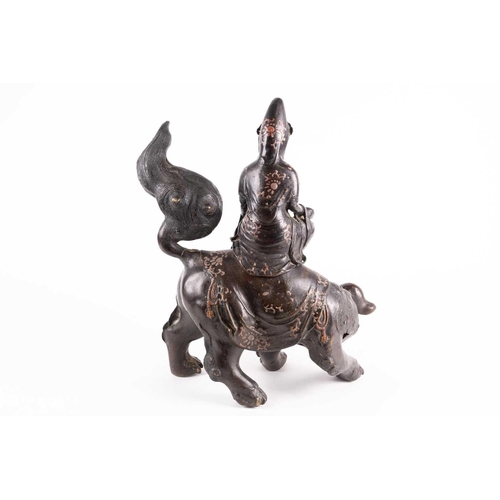 325 - A Chinese bronze figure of Wenshu (Manjusri), Qing, seated in lalitasana upon a Buddhistic lion, dec... 