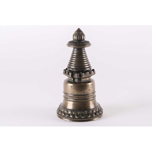 327 - A Tibetan bronze Stupa, 13th/14th century, the lotus bud above a petal moulded and beaded parasol on... 