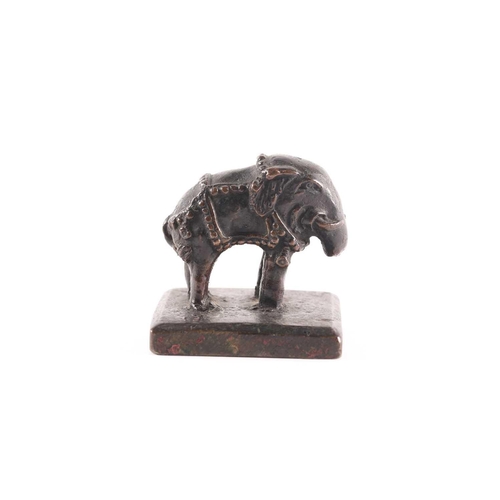 330 - A Chinese bronze elephant seal, early Qing, 17th/18th century, the caparisoned beast standing on all... 