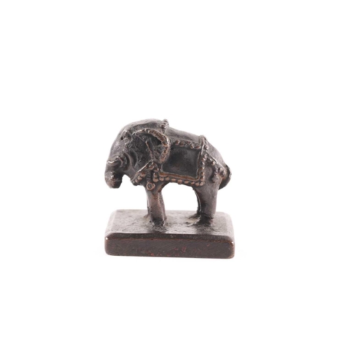 330 - A Chinese bronze elephant seal, early Qing, 17th/18th century, the caparisoned beast standing on all... 