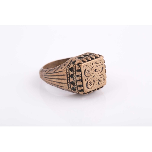 347 - A base metal Indo Persian gentleman's ring, engraved with calligraphic characters