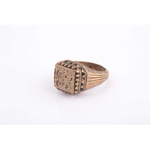 347 - A base metal Indo Persian gentleman's ring, engraved with calligraphic characters