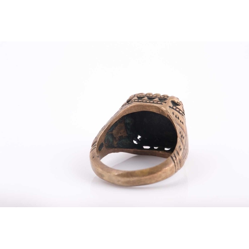 347 - A base metal Indo Persian gentleman's ring, engraved with calligraphic characters