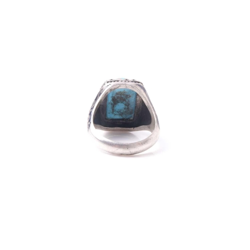 359 - An Eastern niello decorated (925) silver and turquoise gentleman's ring set with a single rectangula... 