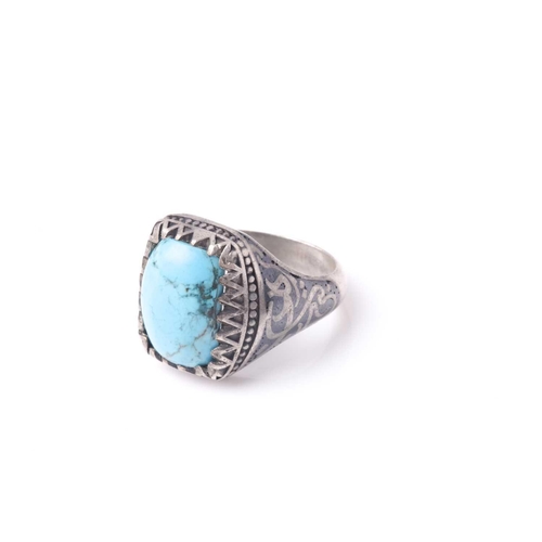 359 - An Eastern niello decorated (925) silver and turquoise gentleman's ring set with a single rectangula... 