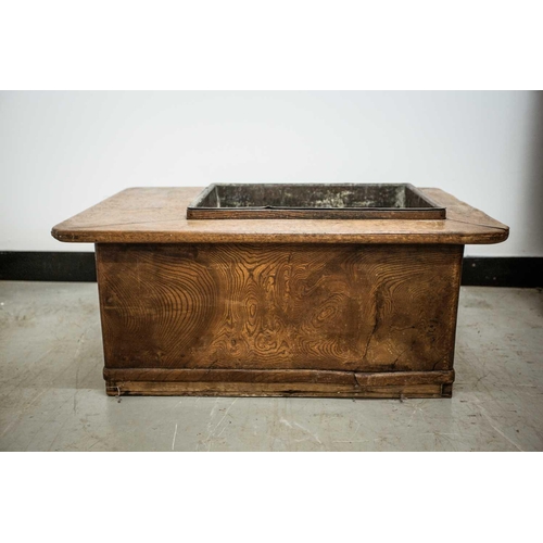 42 - A Japanese keyaki wood hibachi, late 19th century, with rectangular copper liner, above four short d... 