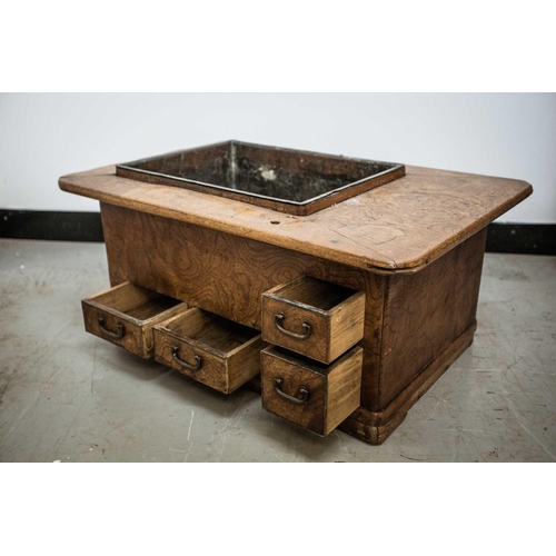 42 - A Japanese keyaki wood hibachi, late 19th century, with rectangular copper liner, above four short d... 