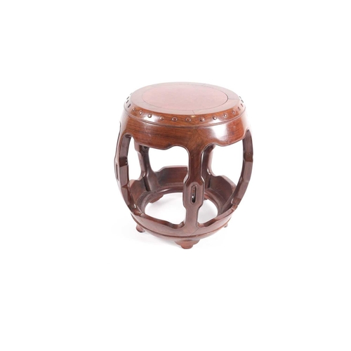 53 - A Chinese hongmu drum form vase stand, 20th century, the top inset with a burr wood roundel, the top... 