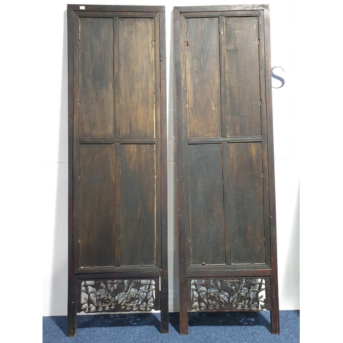 59 - A pair of Chinese hardwood screen panels, each base inset with matching carved lotus flower panels, ... 