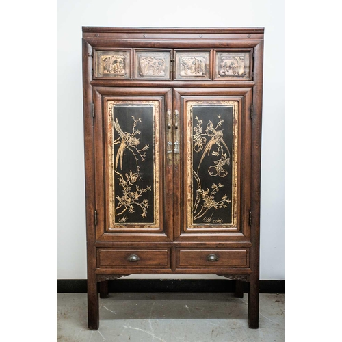 63 - A Chinese hardwood cabinet, late Qing, with four Chaozhou style gilt and carved wood panels set in t... 