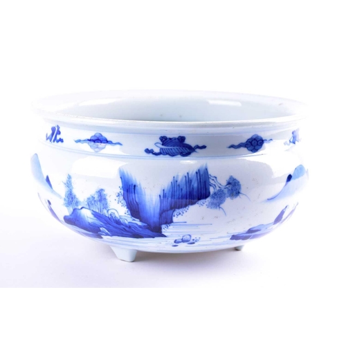 73 - A large Chinese porcelain blue & white Kangxi style censer, painted with scholarly figures in a moun... 