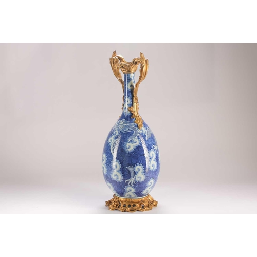 74 - A Chinese blue & white dragon vase, Qing, 19th century, with ormolu mounts, painted with two writhin... 