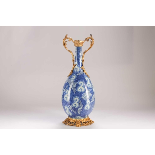 74 - A Chinese blue & white dragon vase, Qing, 19th century, with ormolu mounts, painted with two writhin... 