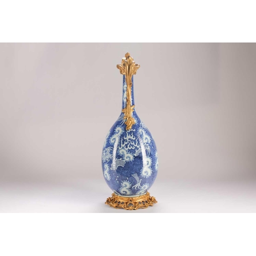 74 - A Chinese blue & white dragon vase, Qing, 19th century, with ormolu mounts, painted with two writhin... 