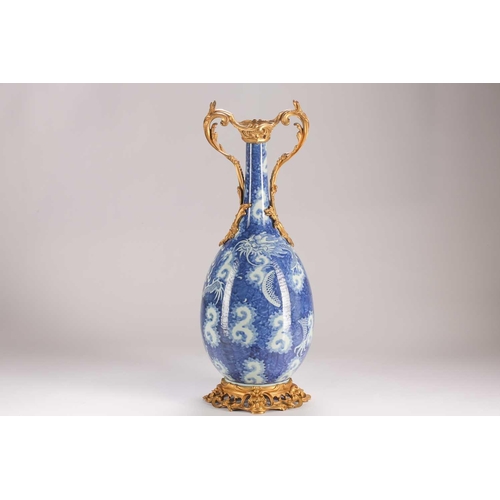 74 - A Chinese blue & white dragon vase, Qing, 19th century, with ormolu mounts, painted with two writhin... 