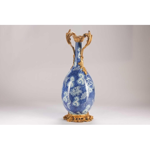 74 - A Chinese blue & white dragon vase, Qing, 19th century, with ormolu mounts, painted with two writhin... 