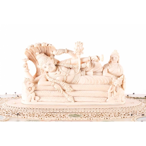 76 - An impressive Indian ivory casket, 19th century, the hinged cover mounted with a recumbent Lord Vish... 