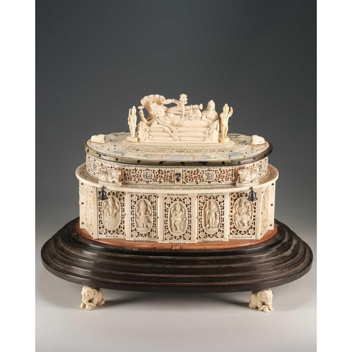 76 - An impressive Indian ivory casket, 19th century, the hinged cover mounted with a recumbent Lord Vish... 