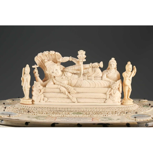 76 - An impressive Indian ivory casket, 19th century, the hinged cover mounted with a recumbent Lord Vish... 