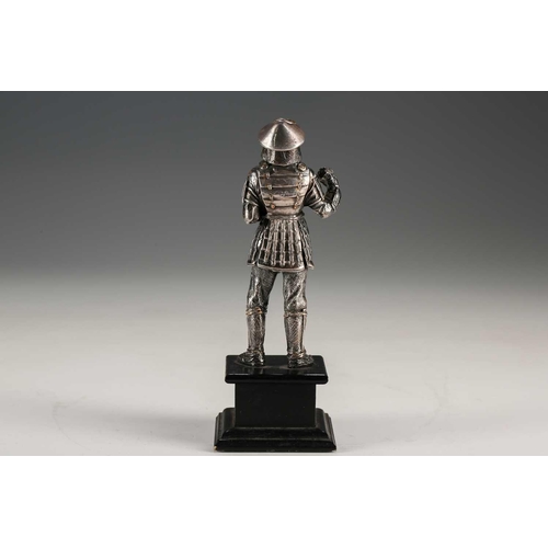 78 - A Japanese silver figure of a Samurai warrior, Meiji period, standing in full armour, the helmet and... 