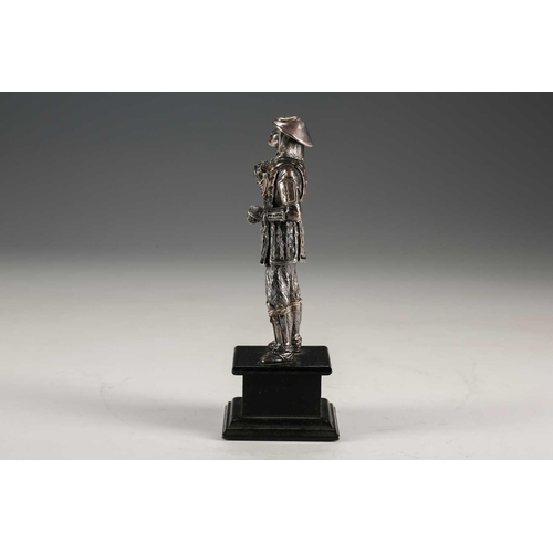 78 - A Japanese silver figure of a Samurai warrior, Meiji period, standing in full armour, the helmet and... 