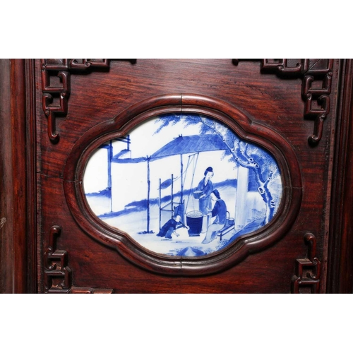 81 - A Chinese six panel hongmu folding room divider with blue & white panels, Qing, 19th century, the se... 