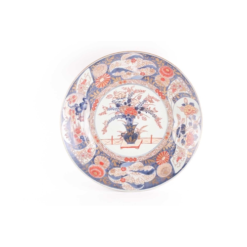 85 - A large Japanese imari dished charger, Edo period, 18th century, the centre with floral display fram... 