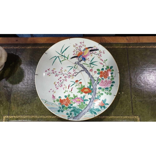 86 - A large Japanese charger, 19th century, painted with a bird alighting on a blossoming plum branch, w... 