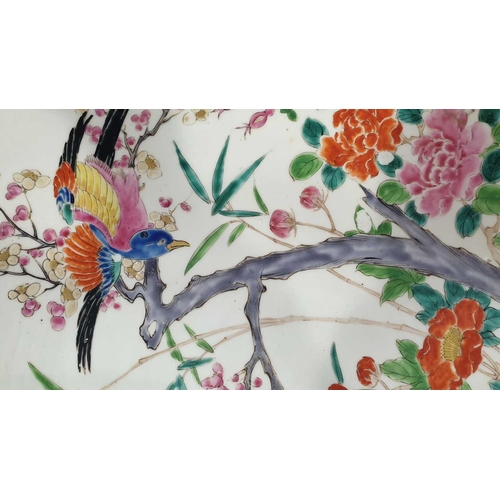 86 - A large Japanese charger, 19th century, painted with a bird alighting on a blossoming plum branch, w... 