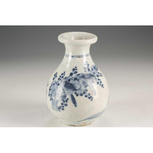 94 - A Japanese blue & white vase, Edo, mid 17th century, the folded over rim above birds in blossoming p... 