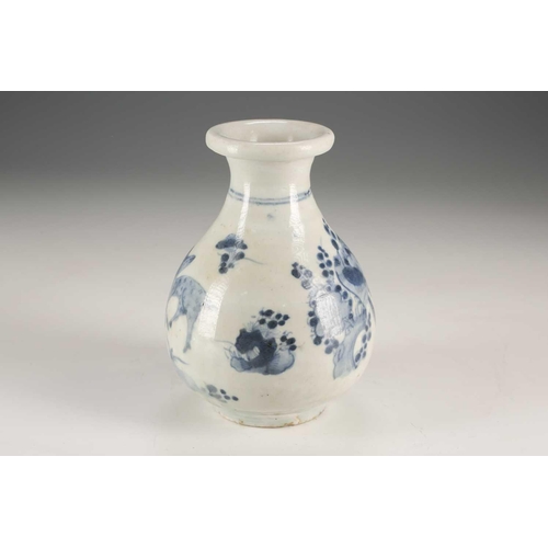 94 - A Japanese blue & white vase, Edo, mid 17th century, the folded over rim above birds in blossoming p... 