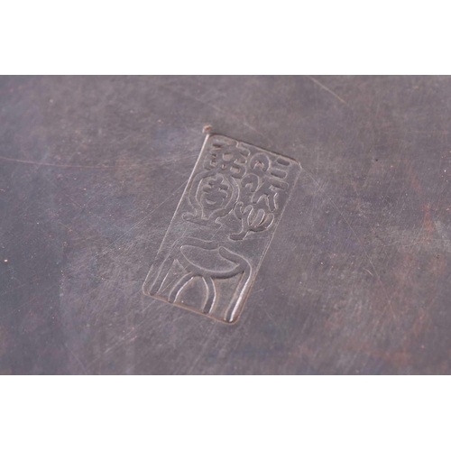 95 - A Chinese white metal inkstone box, Republic period, of square form, the cover engraved with a garde... 