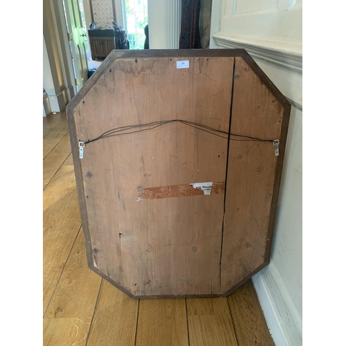 68 - An early 20th century flame grain mahogany framed canted rectangular wall mirror. 75cm wide x 100cm ... 