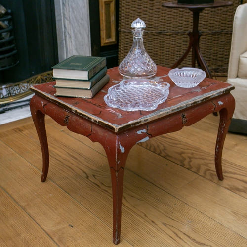 76 - A 19th century Chinese engraved rouge lacquer low table with moulded top, the base with moulded frie... 