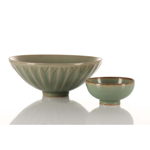 102 - A Chinese Longquan celadon bowl, the exterior with moulded leaves, with unglazed rim and foot rim, o... 