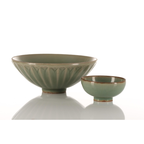 102 - A Chinese Longquan celadon bowl, the exterior with moulded leaves, with unglazed rim and foot rim, o... 