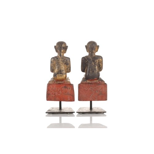 105 - A pair of Burmese carved painted and gilt kneeling monk figures thought to be Ava period 1364-1555. ... 