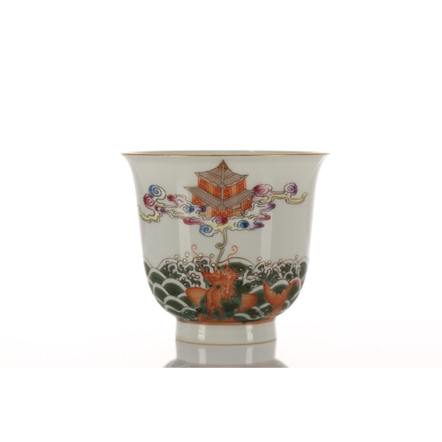 124 - A Chinese porcelain wine cup, the exterior finely painted with two dragon carp in spuming waves and ... 